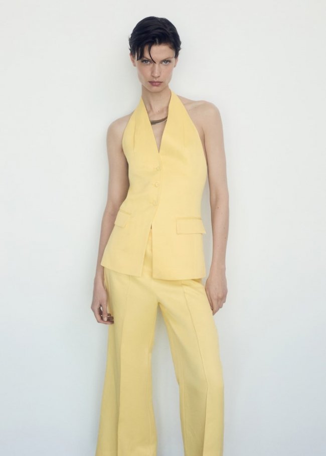 Mango Pantalón flare detalle plisado - Amarillo pastel